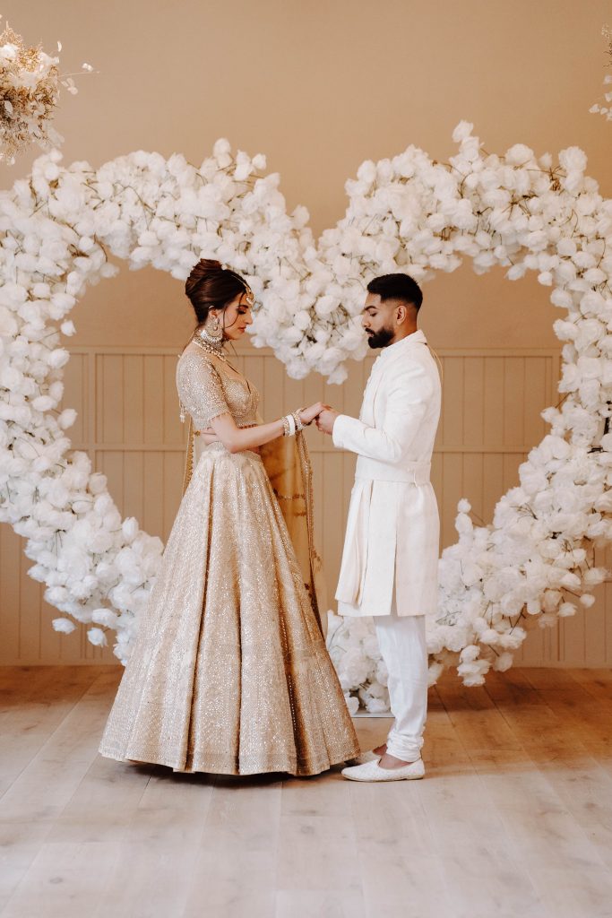 Wedding Planner and Coordinator @Saritaxo and @letlovebeweddings Photographer @tessvieraphotography Videographer @alexmillerweddings Venue Stylist @sparkleeventstyling Models @m.allikaaa @ryansagar Violinist @dovestringsmusic Hair @marlenaluczak Florist @the_barn_flower_design Makeup @harpzmakeup Cake @cakesbysophiepage Champagne Tower @elegant_events_staffordshire Content Creator @thosecontentgirls Bollywood Dancers @bollywooddreamsdance and @reenadance Bollywood Musician and Singer @thebollywoodmusician Wedding Favour Cupcakes @thefloweringbaker Dress Designer and Head Stylist @lordharedhami @sharonscouture Stationary @mallyscrafts Mehndi Artist @simzu_designs Welcome Sign & Personalised Flutes @foreverhalodesigns Venue - Hampton Manor